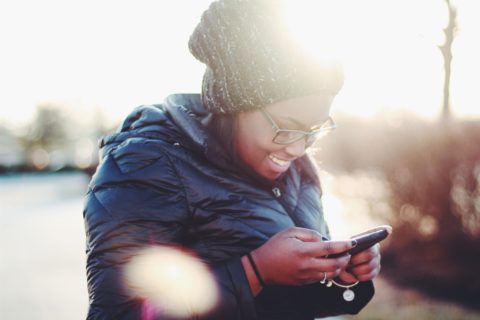 Woman on a smartphone. Photo by Meghan Schiereck/Unsplash.