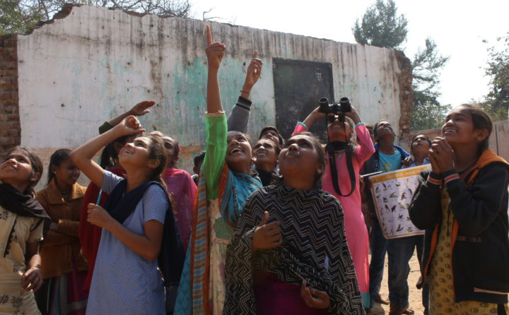 Group of young women birding in India.