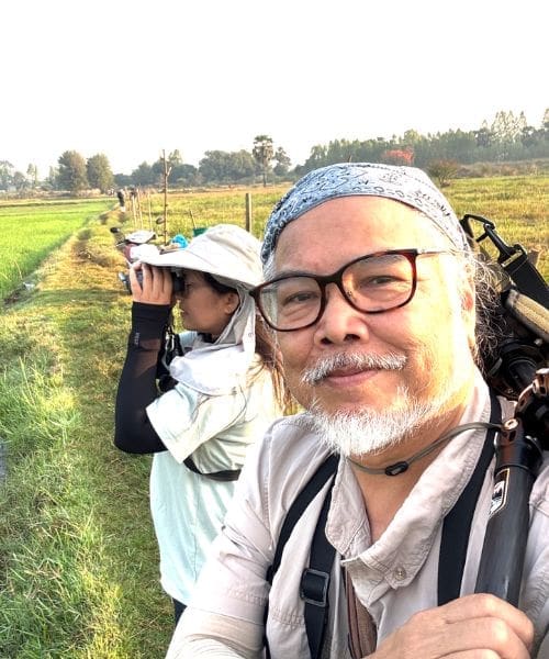Two people birdwatching.