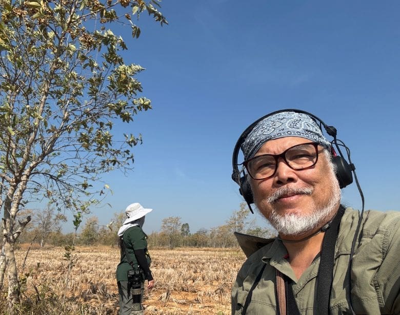 Two people birdwatching.