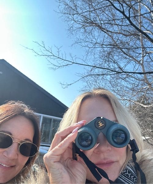 Two people with binoculars.