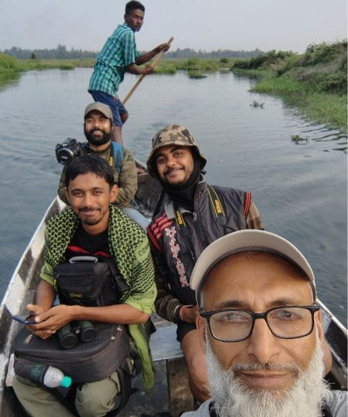 Group of people smiling while on a boat.