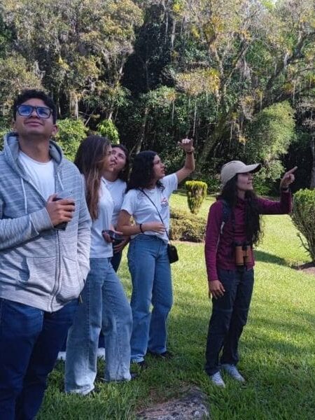 Group of people birdwatching.