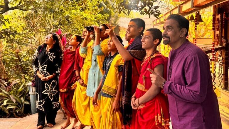 Group of people birdwatching.
